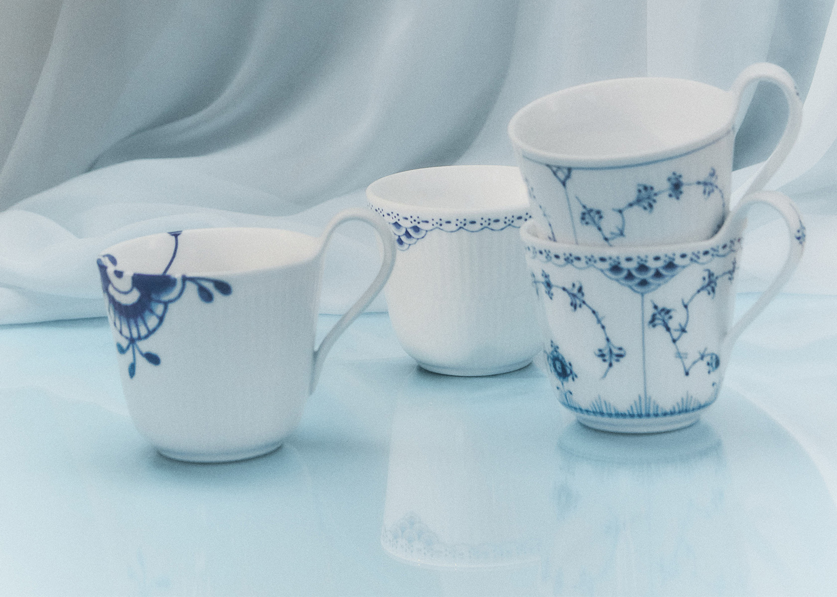 Wrapped in Blue 4 high handle cups different collections from Royal Copenhagen